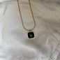 Stylish Golden Necklace With Black Stone - 18K Gold Plated